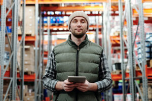 Man standing in a hardware store warehouse.