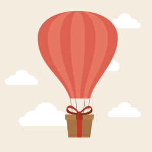 Gift box under a hot air balloon