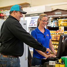 Owner of Buffalo Hardware working with a cashier