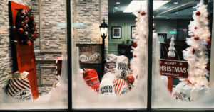 Storefront window decorated for Christmas