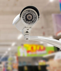 Wall-mounted video surveillance camera inside a store