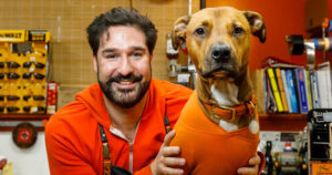Image of Garber Hardware owner Nathaniel Garber Schoen and his dog Kang.
