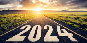 Images of 2023 on a roadway with sunrise in the background