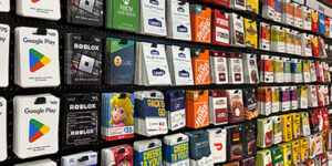 A retail display filled with gift cards.