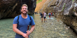 Paladin Relationship Specialist Austin Lee hiking in Utah canyon.