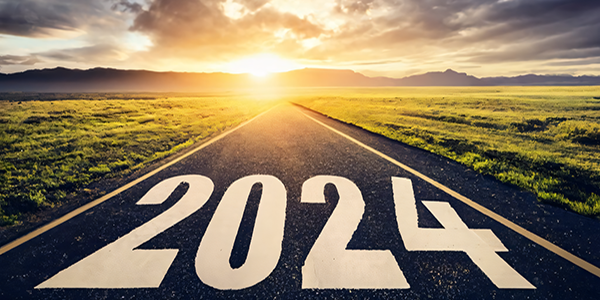 2024 on a roadway in front of a sunrise.