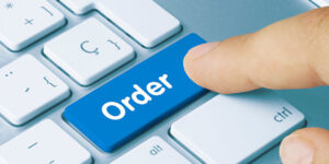 an images of a person's finger pressing an "Order" button on a keyboaard