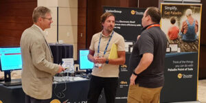 Paladin Business Development Associate Paul Butcher   talks with store owner Daniel Bennaut and Orgill representative Kip Archic.