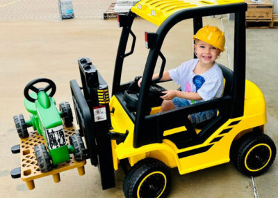 South Beau Hardware Taylor's son in a mini forklift