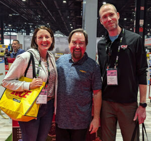 Crossroads Ace owners Christina Beall and Joe Rush rub shoulders with Home Improvement star Richard Karn at the Ace Dealer Market in Chicago.