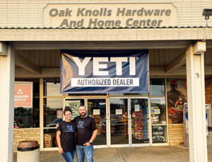 Ben and Alyssa Honeycutt outside their store