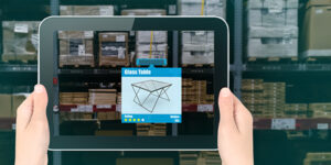 Hands holding a tablet utilizing AI to identify what's is in a warehouse container