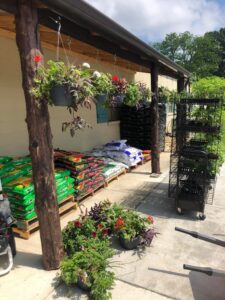 Gardening supplies displayed outside Casto Trading Company