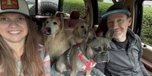 PaladinPOS Product Specialist Michael Horn, his wife, Holly, and their dogs riding in their truck.